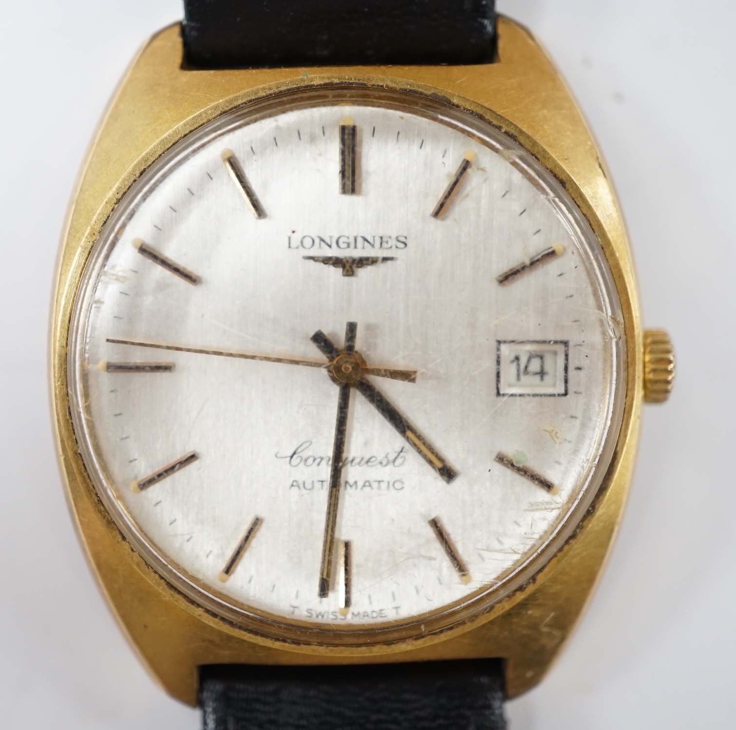 A gentleman's steel and gold plated Longines Conquest automatic wrist watch, with date aperture, on associated leather strap, case diameter 34mm.